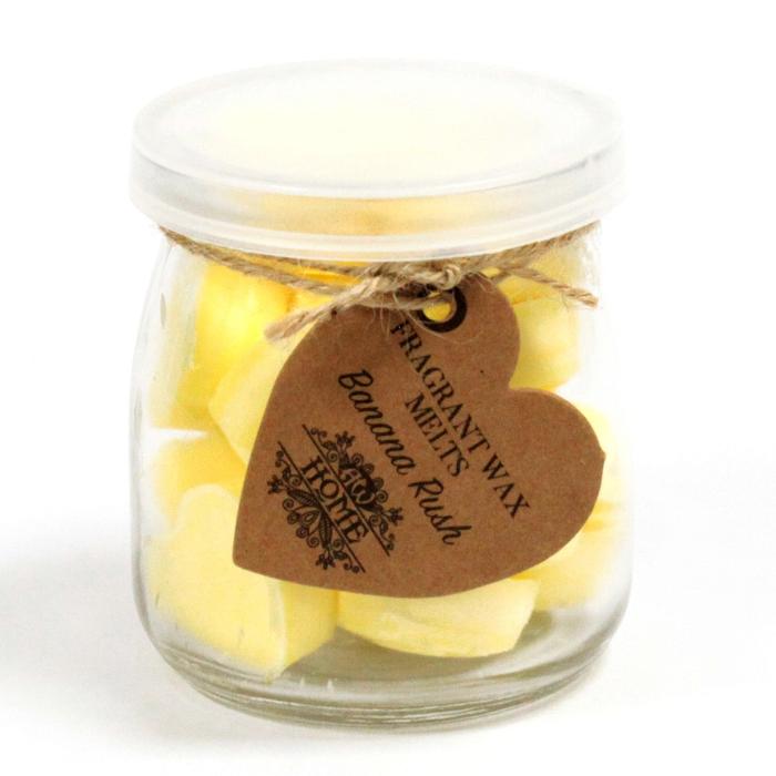 Glazen pot met soja was melts in de geur van banaan, die een zoete, tropische geur verspreidt voor een aangename geurervaring.